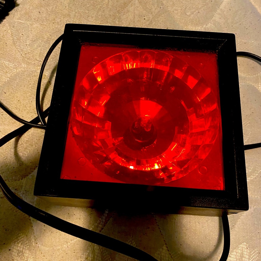 Red Light that goes into the wall. Has settings on it